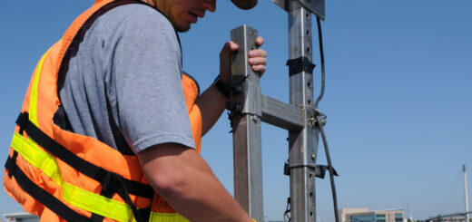 Hydrologic technician with the U.S. Geological Survey secures an ADCP to monitor hydrology conditions